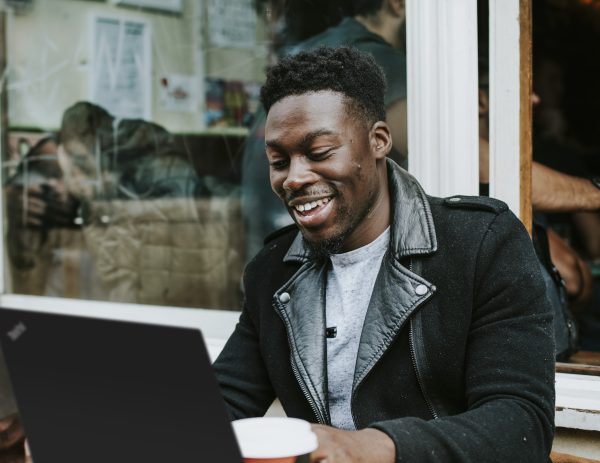 Man sitting outside using ThinkPad laptop