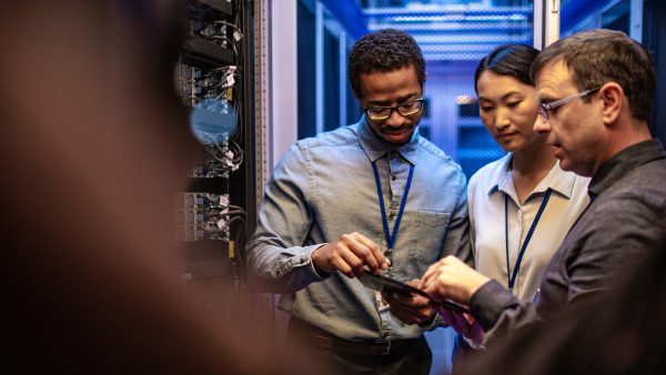 Lenovo brand image - people collaborating in server room