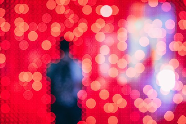 Lenovo brand image - figure obscured by blurry red lights