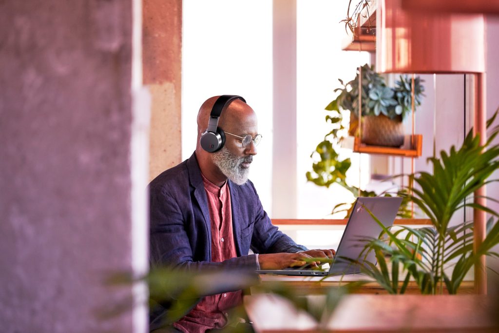 Brand image - Person working on a laptop at home.