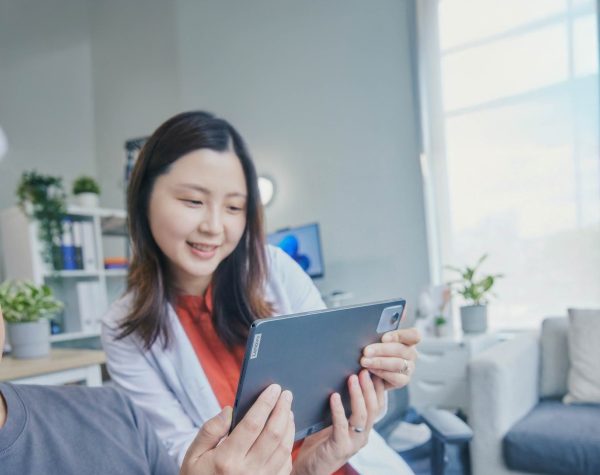 Woman looking at Lenovo tablet