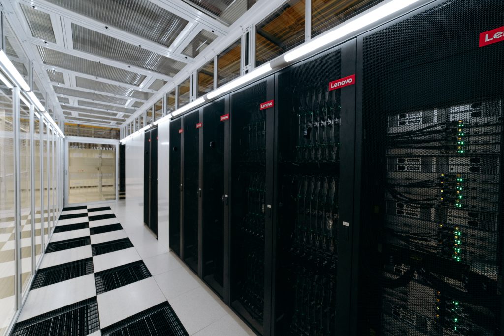 A row of servers behind rack doors with Lenovo logos