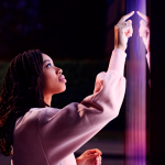 Brand image - person touching a light wall at night