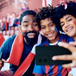 FIFA World Cup - fans taking a selfie in the stadium.