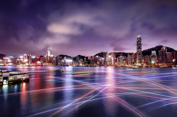 Brand image - lines of color across a city bay at night